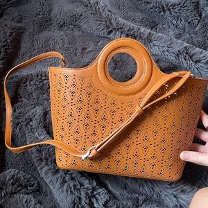 Brown punched leather free people bag